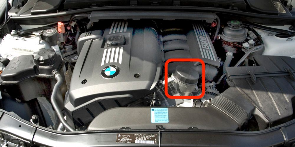 engine bay of an e90 where the oil filter housing is marked
